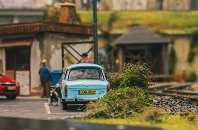 View of car on street against buildings