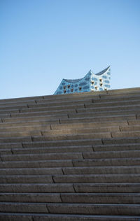 Low angle view of building against clear blue sky