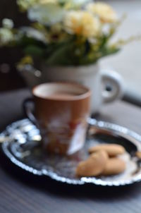 Close-up of coffee cup on table