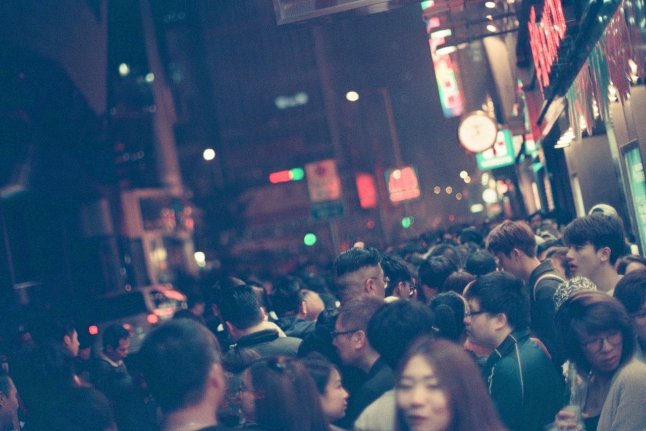 group of people, crowd, large group of people, city, architecture, real people, street, men, night, building exterior, illuminated, built structure, city life, adult, women, city street, togetherness, lifestyles, transportation, nightlife