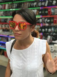 Woman wearing sunglasses at store