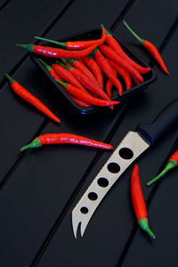 High angle view of red chili peppers on table
