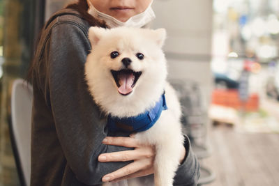 Midsection of woman with dog