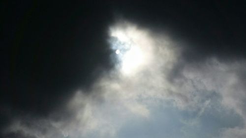 Low angle view of cloudy sky at night