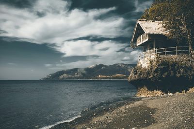 Scenic view of sea against cloudy sky