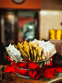 Close-up of flowers in basket on table at market