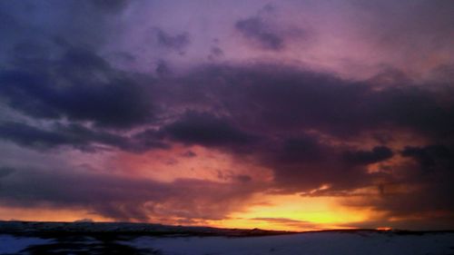 Scenic view of dramatic sky over landscape