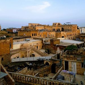 High angle view of buildings in town against sky