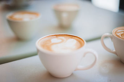 Close-up of cappuccino served on table