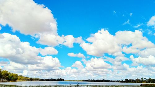 Panoramic view of sea against blue sky