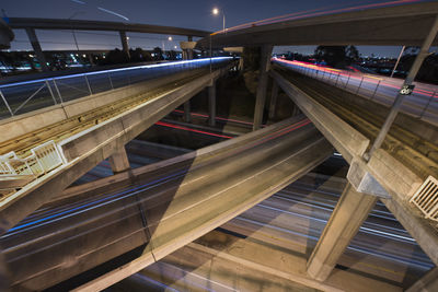 Light trails on elevated roads in city at night