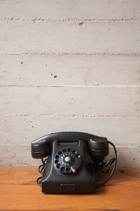 High angle view of telephone on table