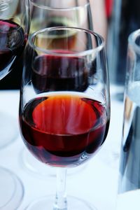 Close-up of red wine in glass on table