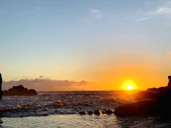 Scenic view of sea against sky during sunset