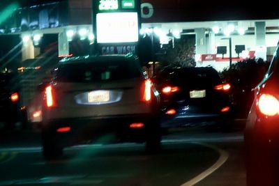 Traffic on road in city at night