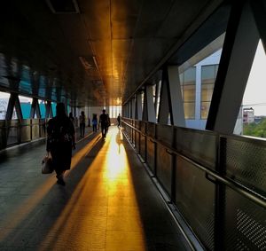 People walking on bridge