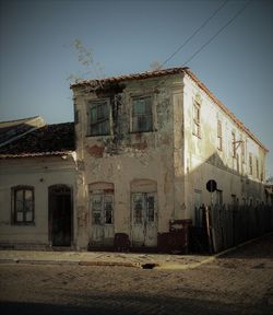 Abandoned building against clear sky