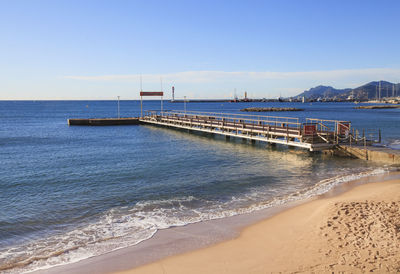 Pier over sea against sky