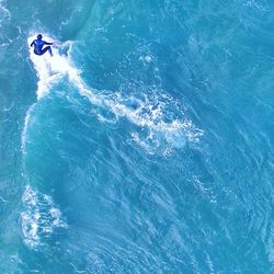 High angle view of man surfing in sea
