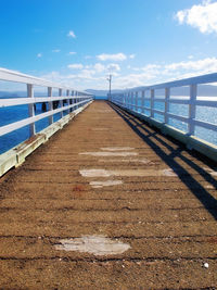 Pier over sea against sky