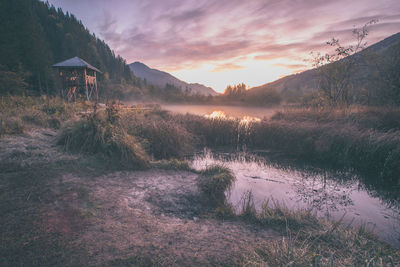 Scenic view of lake against sky during sunset