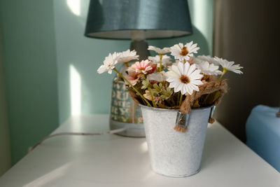 Close-up of white flowers in vase