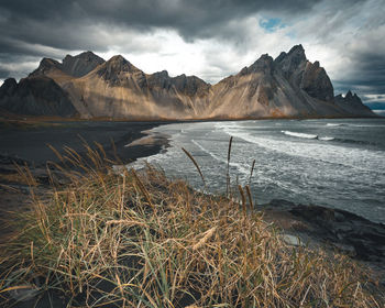 Scenic view of lake and mountains against sky