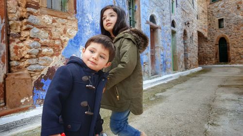 Two children in old town