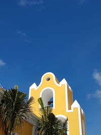 Low angle view of built structure against blue sky