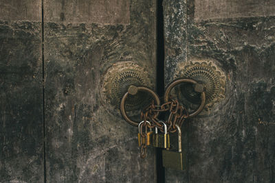 Close-up of padlock on metal door