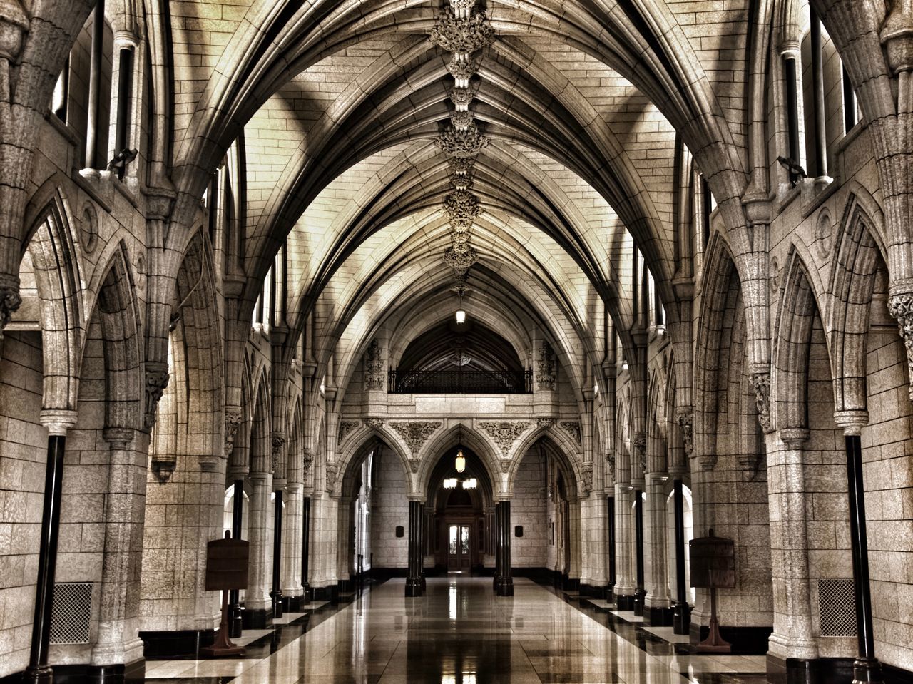 architecture, place of worship, religion, belief, arch, spirituality, built structure, building, indoors, ceiling, architectural column, pew, the past, history, no people, direction, abbey, gothic style, aisle