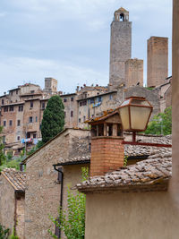 Details of bell towers and brick houses in san gimignano in tuscany, siena - italy.