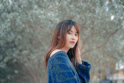 Portrait of beautiful woman standing outdoors