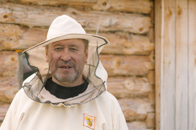 Closeup portrait of a beekeeper in mask