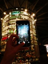 Cropped hands using mobile phone