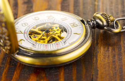 Close-up of clock on table