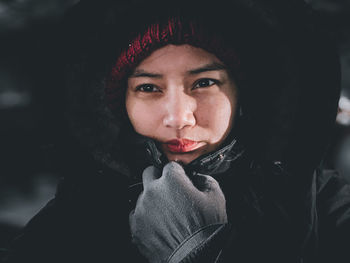 Close-up portrait of woman in snow