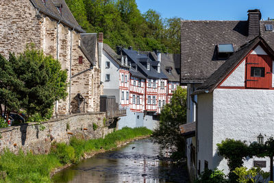 View at river elz, half-timbered houses in monreal, eifel, germany