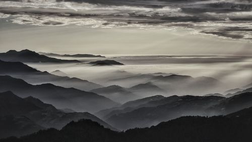 Scenic view of mountains against sky during sunset