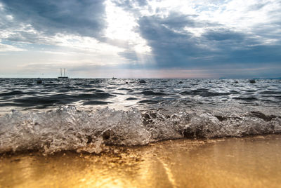 Scenic view of sea against cloudy sky