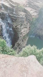 High angle view of river flowing through cliff