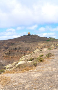Scenic view of land against sky