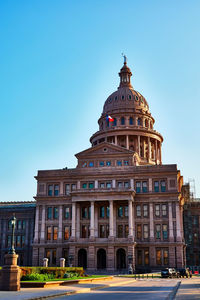 Low angle view of historical congress building against clear sky