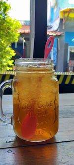 Close-up of drink in glass jar on table