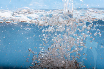 Close-up of water splashing in swimming pool