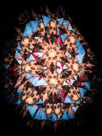 Kaleidoscope pattern of teenage girl reflecting on mirror