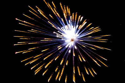 Low angle view of firework display in sky at night