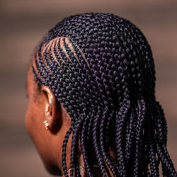 The back view of a lady with african braids