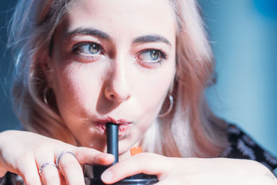Close-up portrait of woman looking away