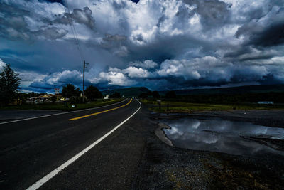 Road against storm clouds